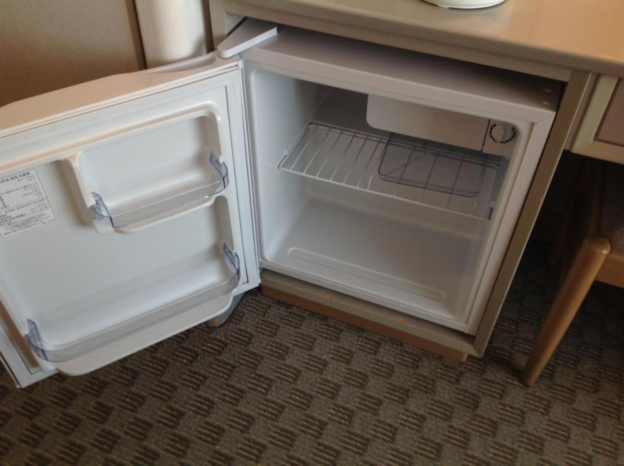 Shin Furano Prince Hotel Номер фото A mini-fridge in a hotel room